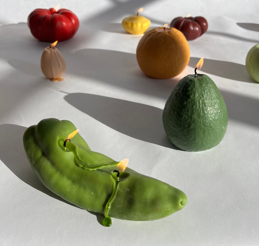 Chili Pepper Candle - Green and unique artisan fruit candles on a white surface, adding colorful decor to your space.