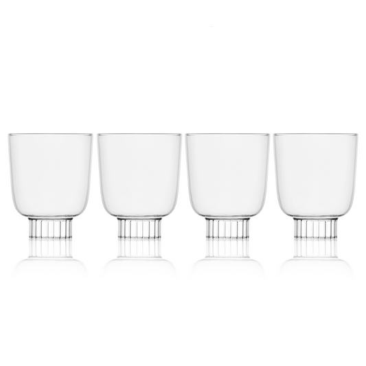 Four clear glass tumblers with metal bases on a white background, labeled 'Selling Fast'.