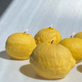 Large Lemon Candle - artisan handcrafted decor featuring vibrant yellow lemon-shaped candles, radiating citrus bliss.