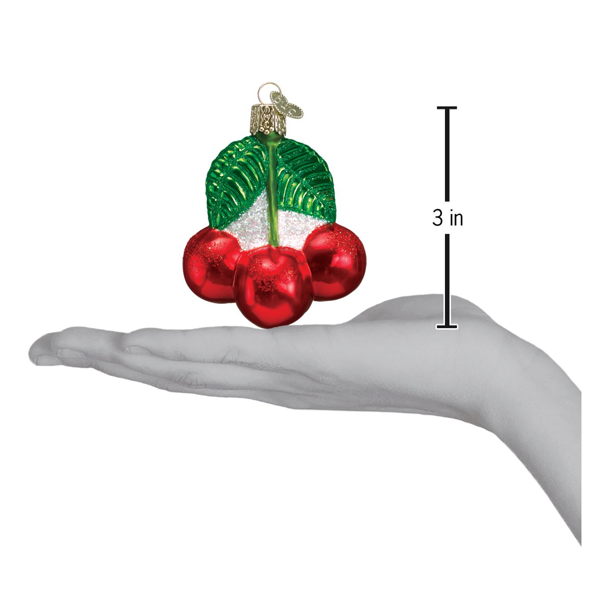 Cherries Ornament in hand, showcasing artisan, handcrafted decor with red cherries and green leaves, 3 inches tall.