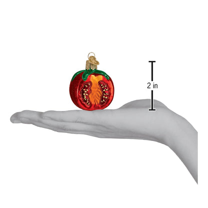 Handcrafted Garden Tomato Ornament, artisan decor, vivid red with green accents, measuring 2 inches tall.