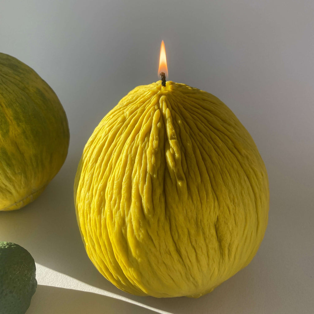 Casaba Melon Candle, a handcrafted artisan decorative candle shaped like a melon, radiating summery vibes.