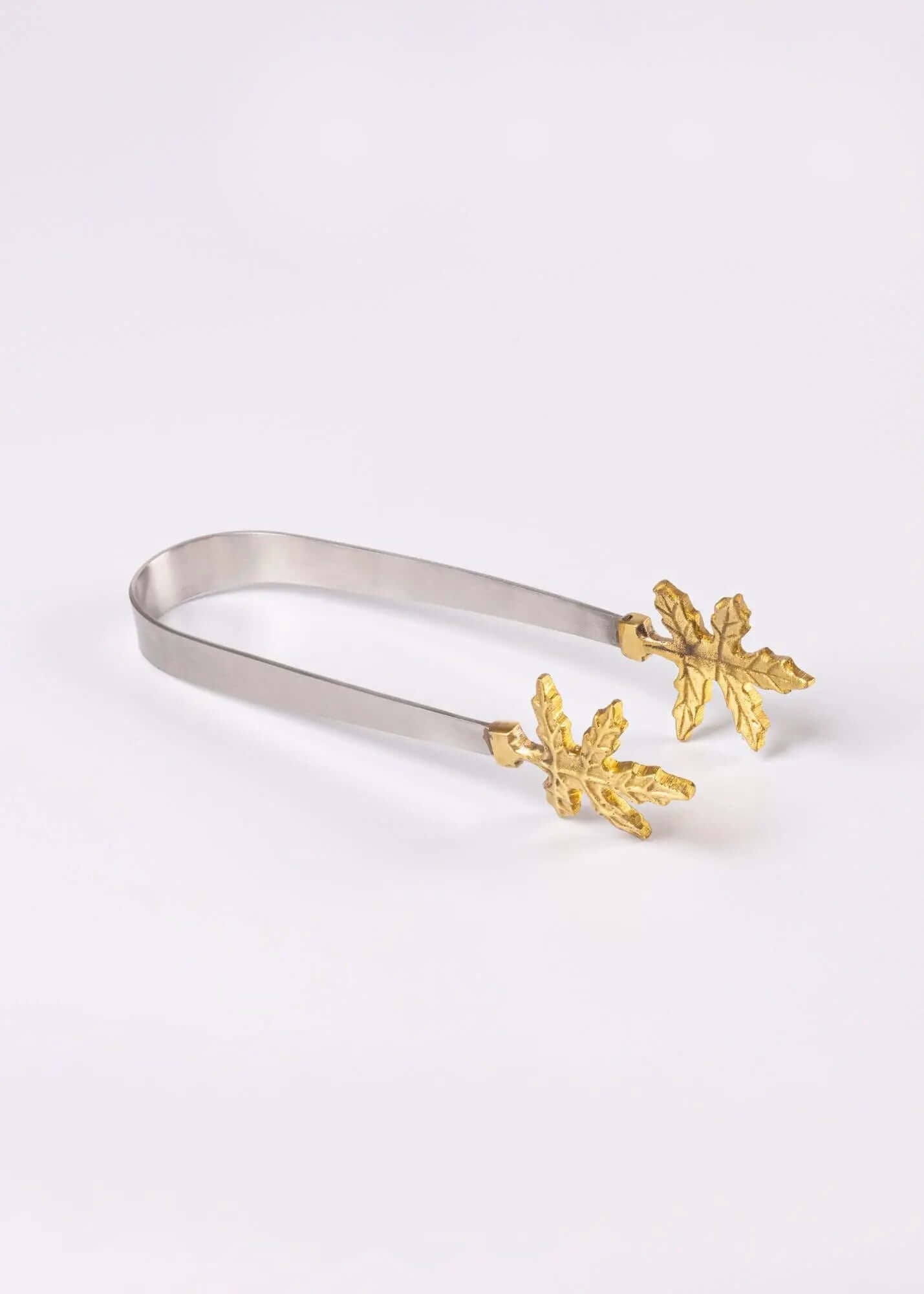 Elegant Brass Leaf Tongs, handcrafted artisan decor with luxurious brass finish, perfect for serving snacks and desserts.