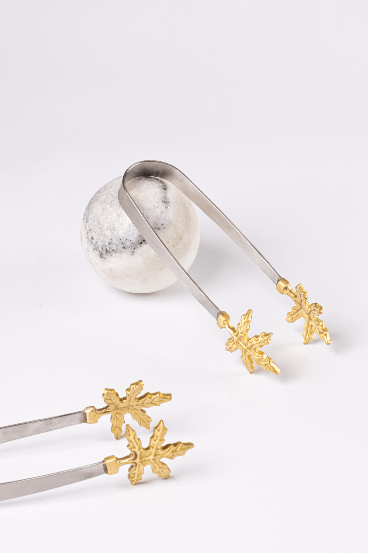 Elegant Brass Leaf Tongs, handcrafted decor piece combining artisan beauty and functionality.