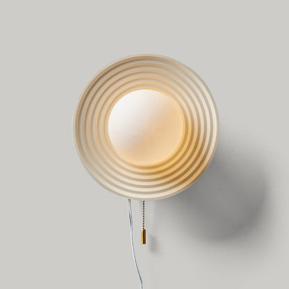 Artisan Echo Sconce with concentric circle design, handcrafted and dimmable wall decor solution.