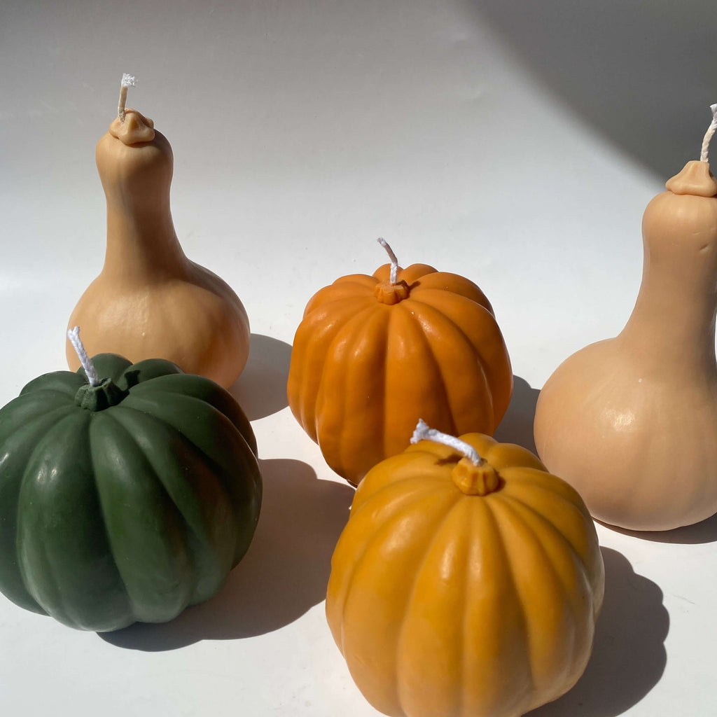 Squash Candle collection featuring artisan handmade candles in squash shapes, perfect for decor. Hand-poured with 100% soy wax.