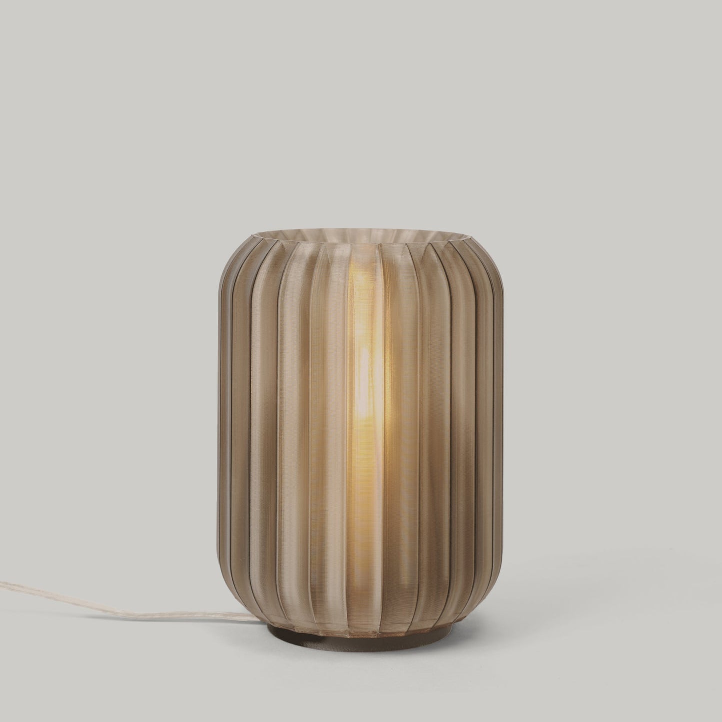 Mini Allium Lamp showcasing a sculptural design and soft ambient light, perfect for any cozy corner.
