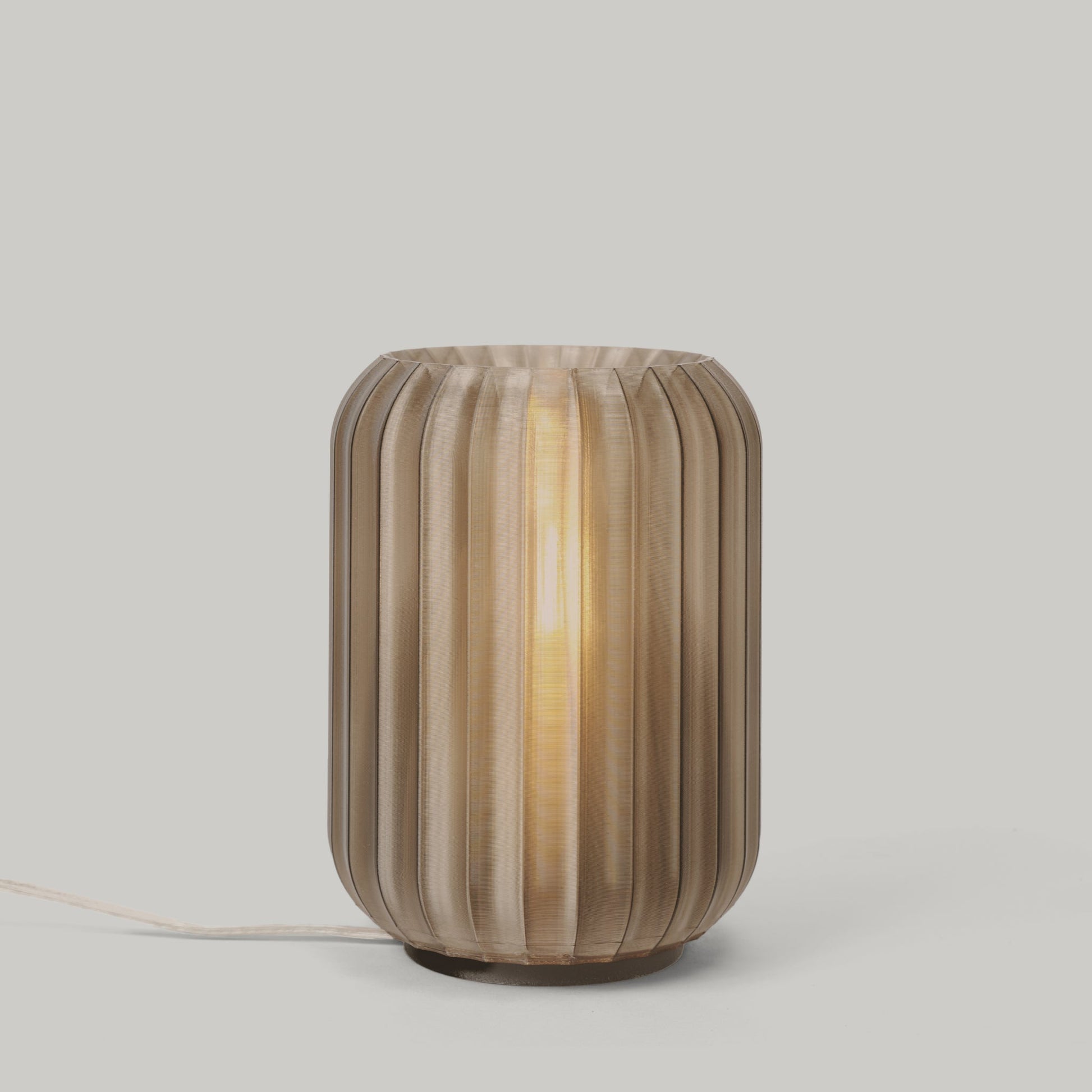 Mini Allium Lamp showcasing a sculptural design and soft ambient light, perfect for any cozy corner.