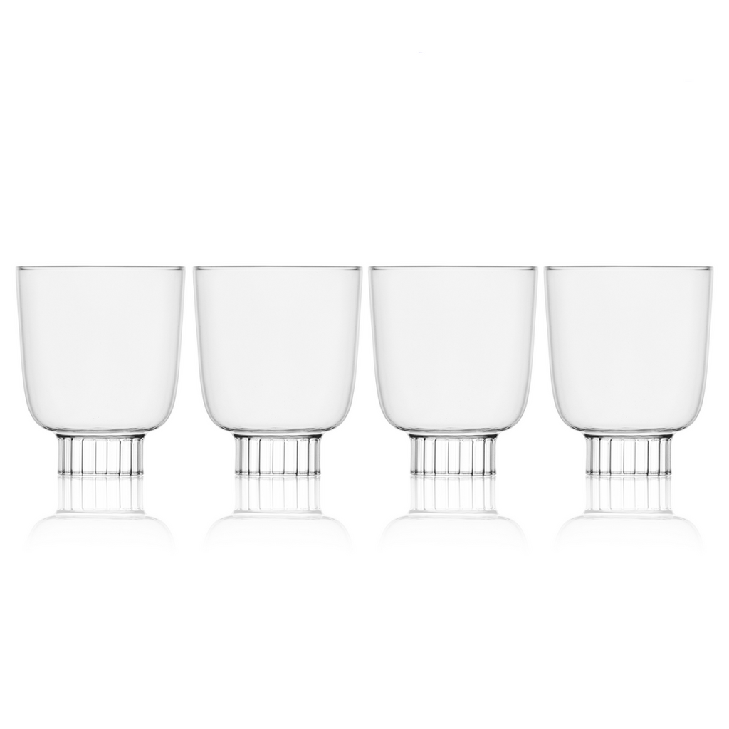 Four clear glass tumblers with metal bases on a white background, labeled 'Selling Fast'.