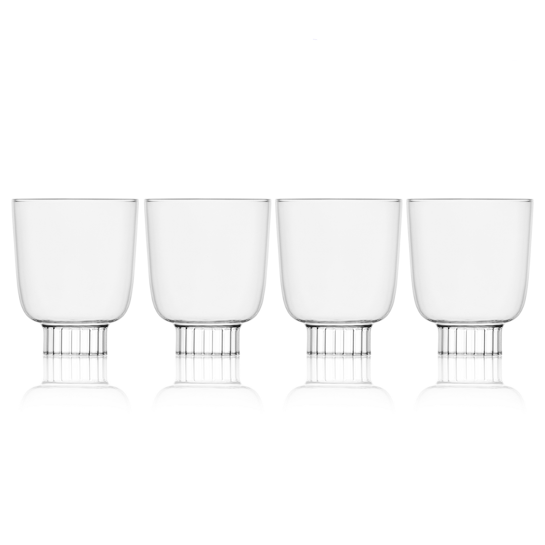 Four clear glass tumblers with metal bases on a white background, labeled 'Selling Fast'.