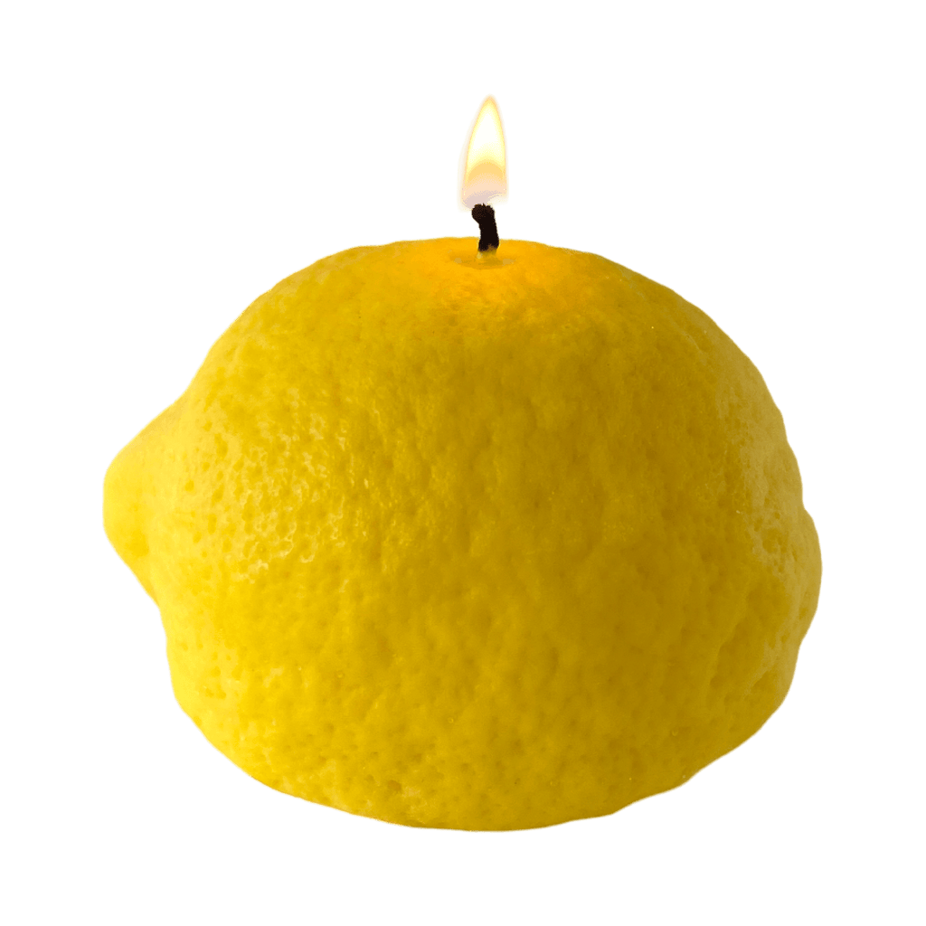 Large Lemon Candle handcrafted decor, artisan citrus-scented candle with a warm glowing flame.