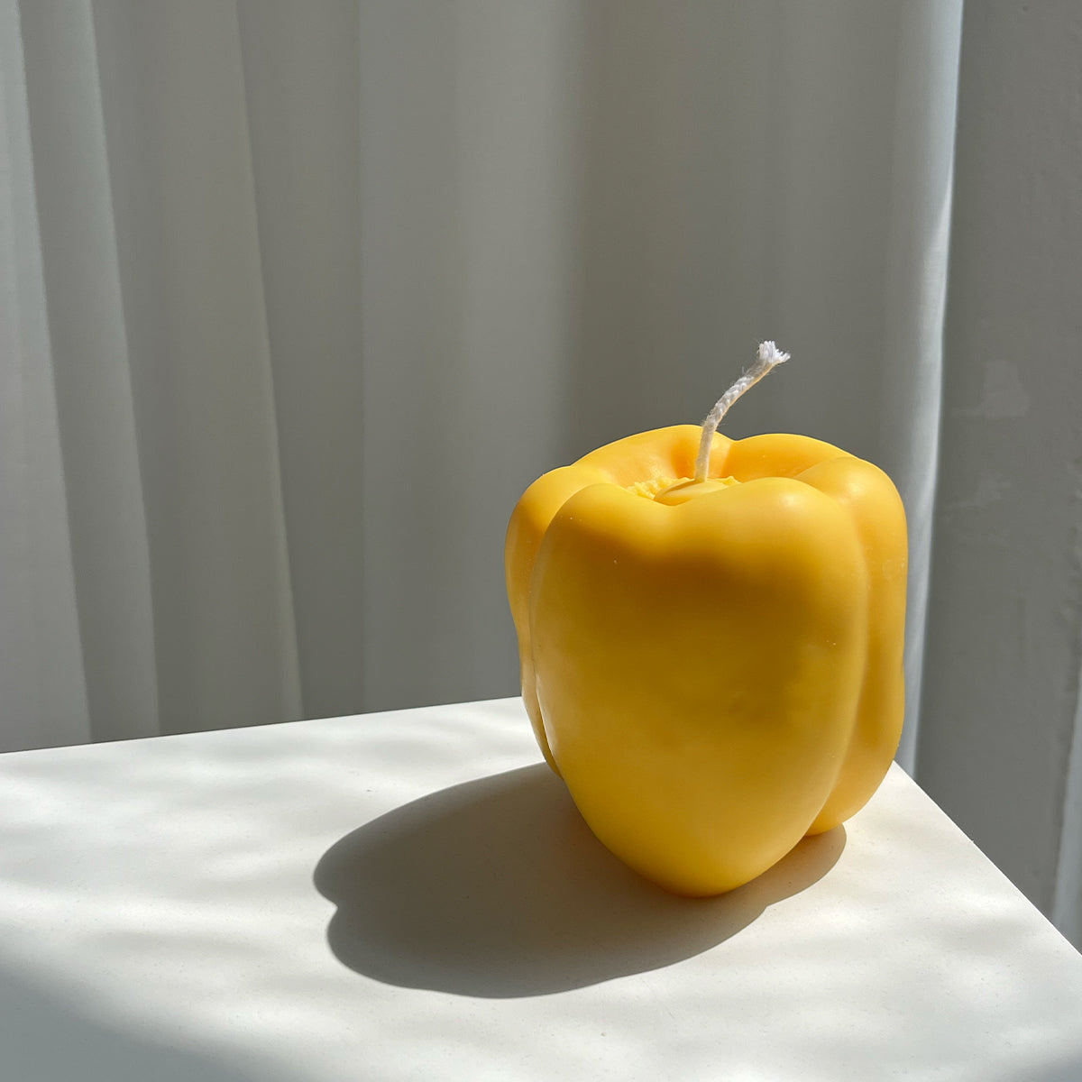 Bell Pepper Candle - Yellow artisan handcrafted decor in a vibrant yellow, perfect for any handmade aesthetic.