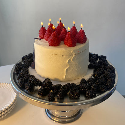 Strawberry Candles - 8 Pack cake decoration with fresh strawberries and blackberries on a silver cake stand.