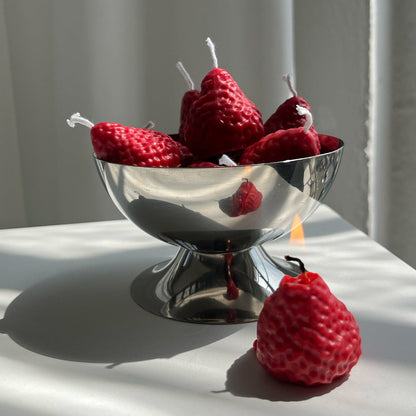 Strawberry Candles - 8 Pack in a shiny bowl, showcasing handcrafted artisan decor perfect for home fragrance.